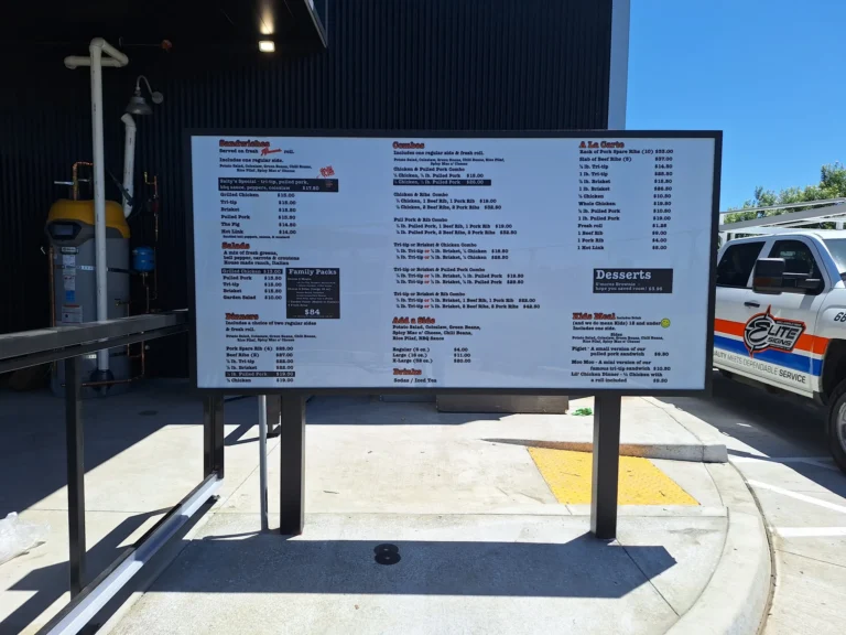 Custom outdoor illuminated menu board installed by Elite Signs at Salty's BBQ & Catering in Bakersfield, CA